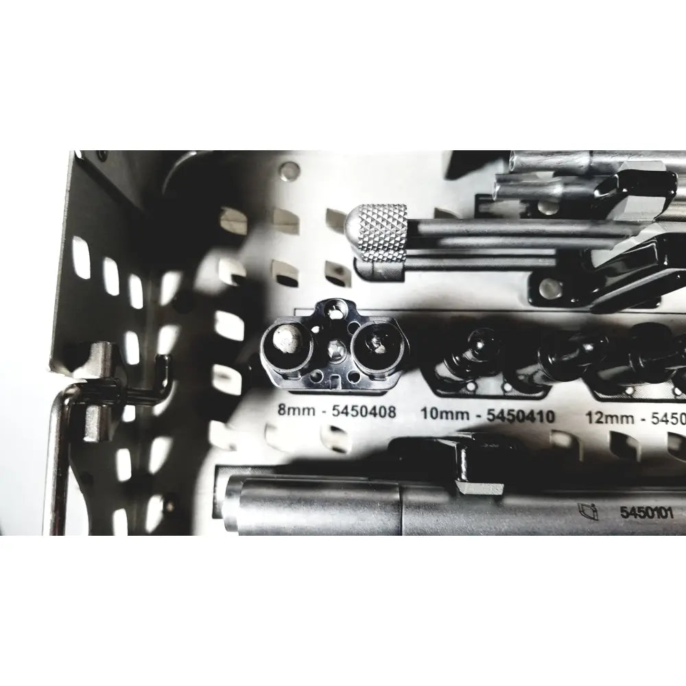 A set of chrome precision screwdriver bits with black handles in a metal tray for Nuvasive speed innovation coroent xl-fixation