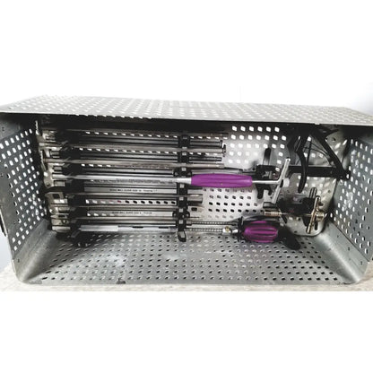 A metallic surgical instrument tray holding multiple purple-handled bone wall guides for nuvasive speed innovation coroent xl-fixation