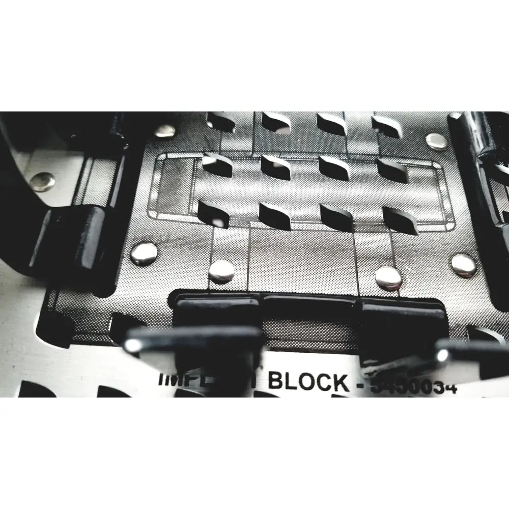 Silver metallic nuvasive speed innovation coroent xl-fixation instrument tray with black plastic components and cut-out slots