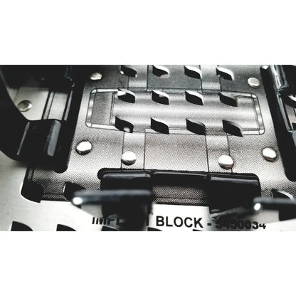 Silver metallic nuvasive speed innovation coroent xl-fixation instrument tray with black plastic components and cut-out slots