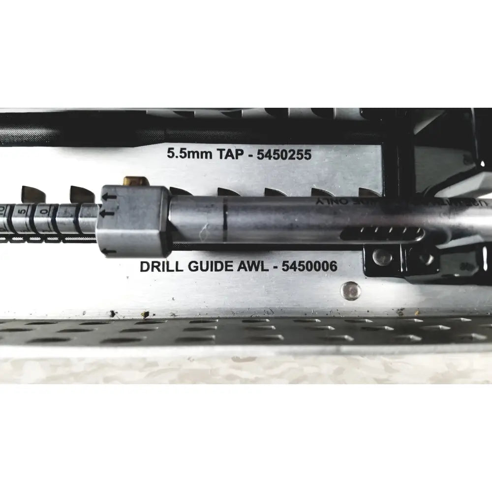 Silver metallic drill guide awl with engraved markings and textured grip in nuvasive speed innovation coroent xl-fixation tray