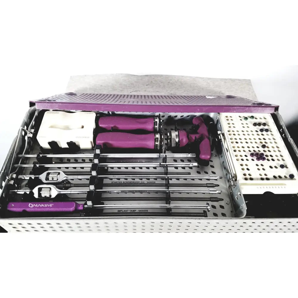 Purple-handled surgical instruments and implants organized in a perforated metal tray with purple lid by nuvasive speed innovation coroent xl-fixation