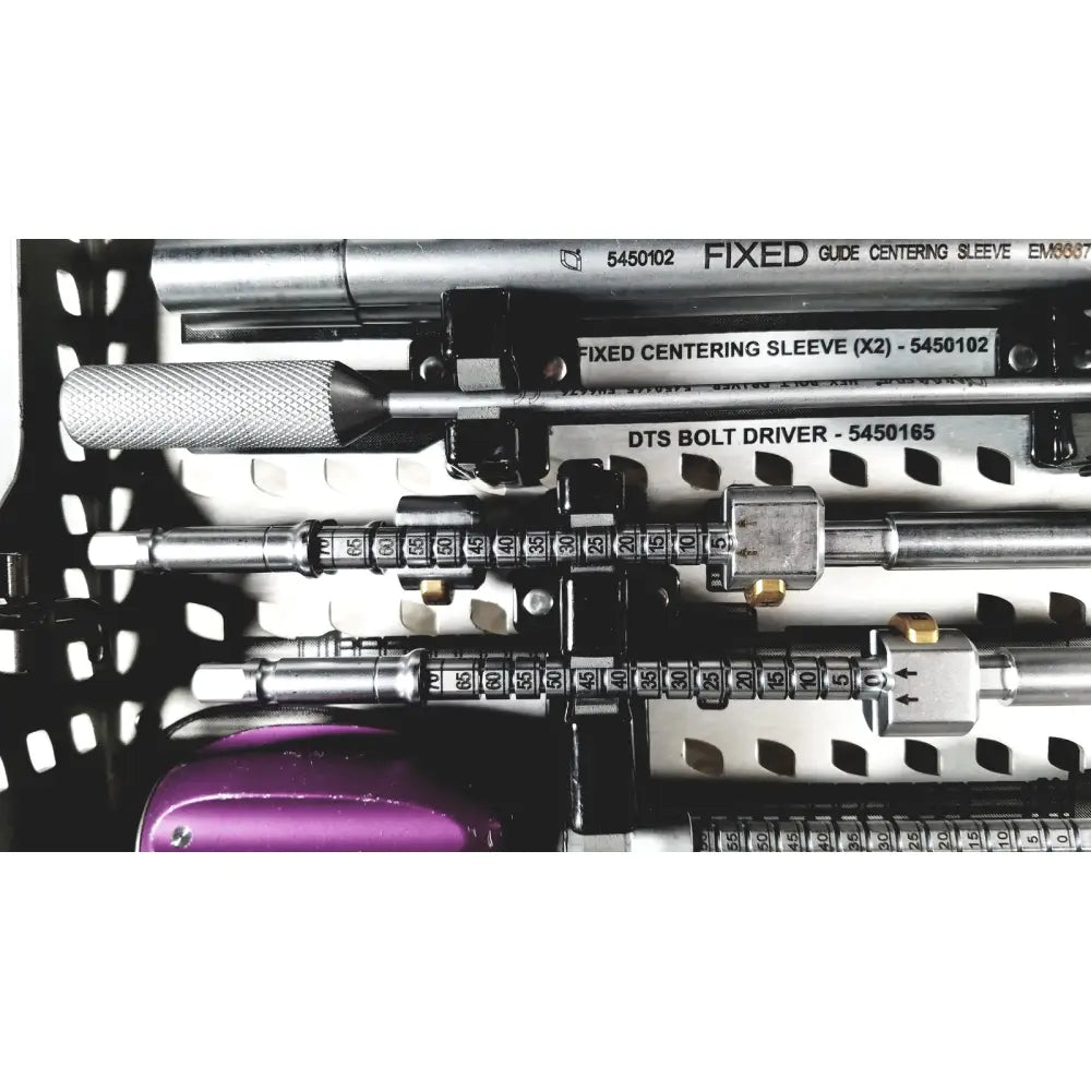 Silver metallic dts bolt driver with textured grip and numbered dials in nuvasive speed innovation coroent xl-fixation tray