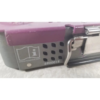 Purple and gray nuvasive xlif x1 instrument tray with metallic latch and ventilation holes for surgical instruments