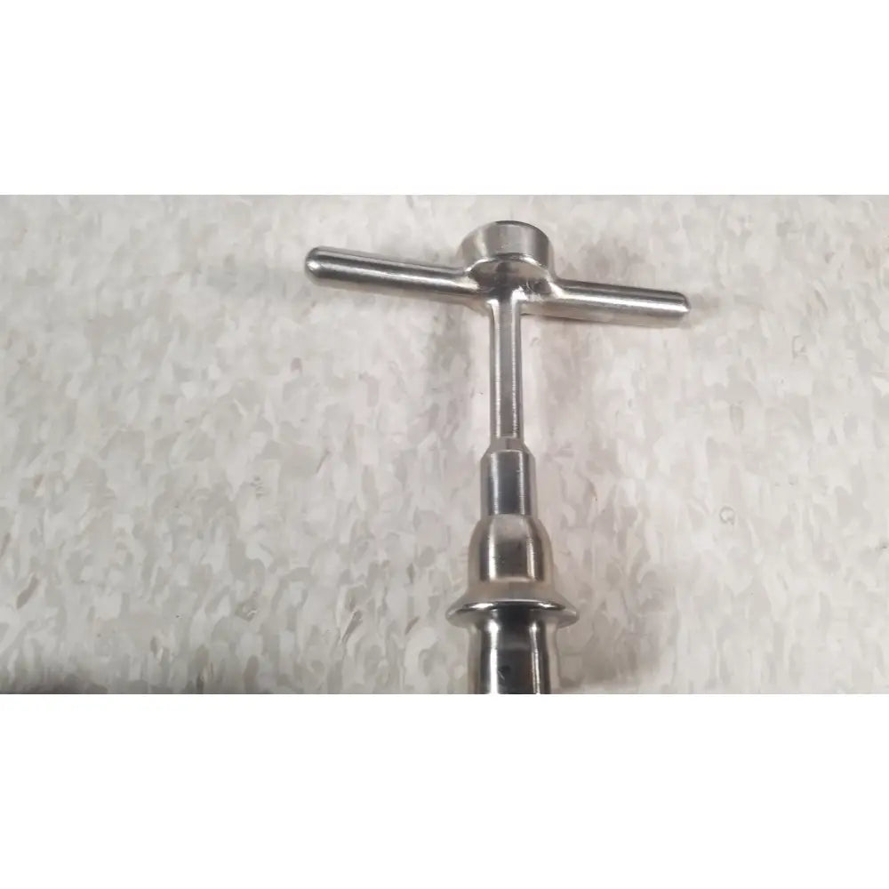 Stainless steel t-handle bottle opener with polished finish and ergonomic design for nuvasive xlif x1 instrument tray use