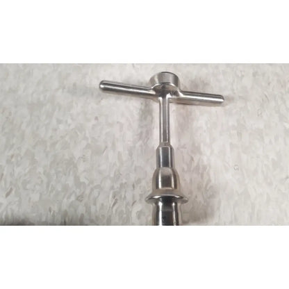 Stainless steel t-handle bottle opener with polished finish and ergonomic design for nuvasive xlif x1 instrument tray use