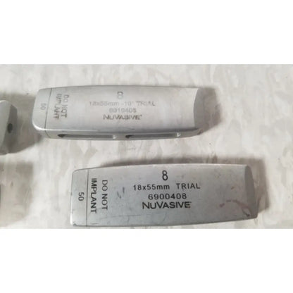 Silver metallic dental implant trial models with engraved nuvasive brand name for nuvasive xlif x1 instrument tray missing piece