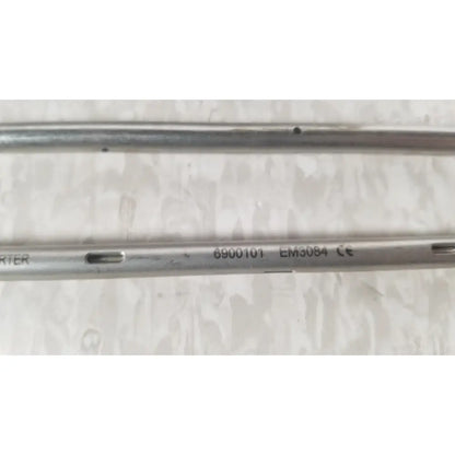 Silver metallic surgical rod with engraved 6900101 em3084 and ce markings from nuvasive xlif x1 instrument tray