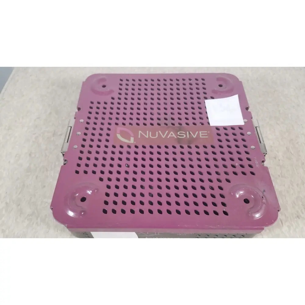 Purple perforated metal nuvasive xlif x1 instrument tray designed for surgical instrument storage and organization
