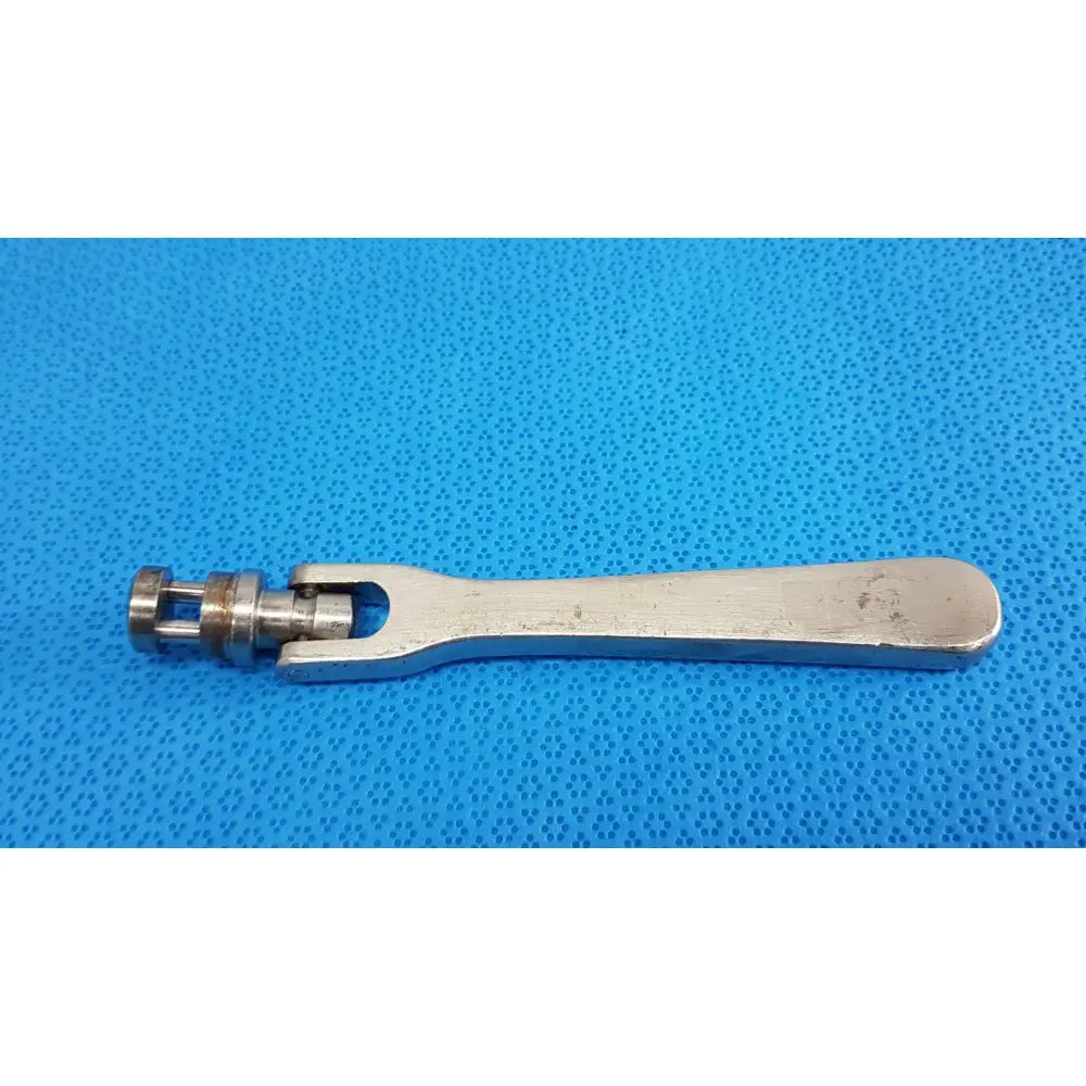 Silver-colored metal octobase retractor handle with mechanical joint for surgical retractor positioning component
