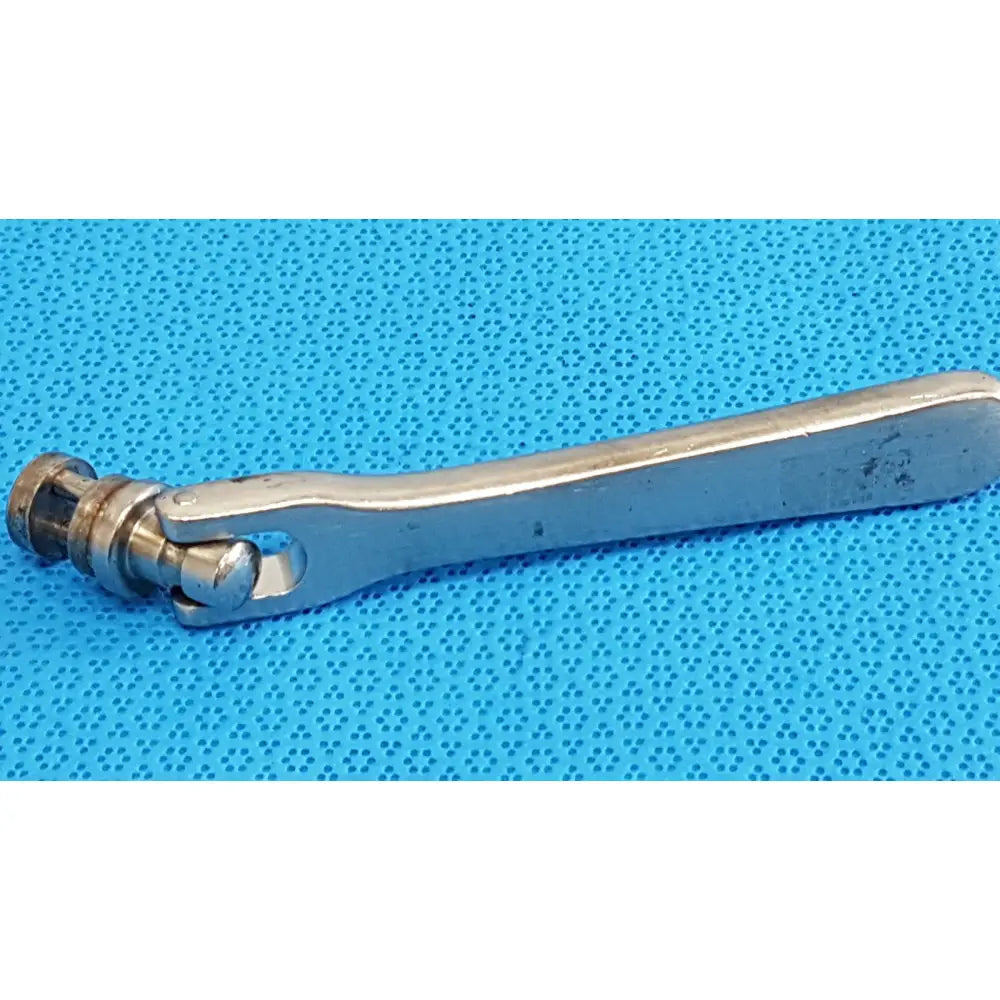 Silver-toned metal octobase retractor handle with polished finish and visible wear for surgical retractor positioning