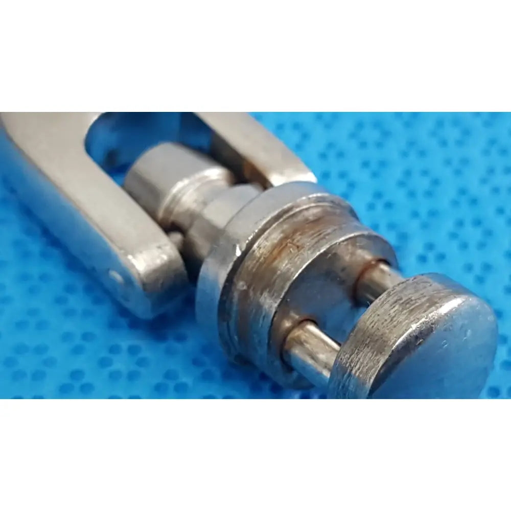 Silver-toned metal hitch pin with cylindrical body and threaded ends for octobase retractor handle surgical positioning