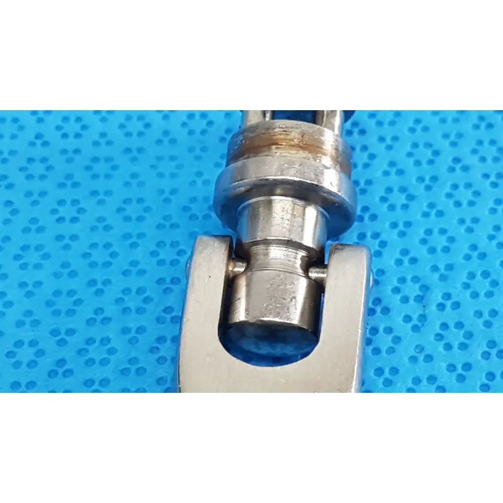 Stainless steel octobase retractor handle with polished finish and wear marks for surgical retractor positioning component