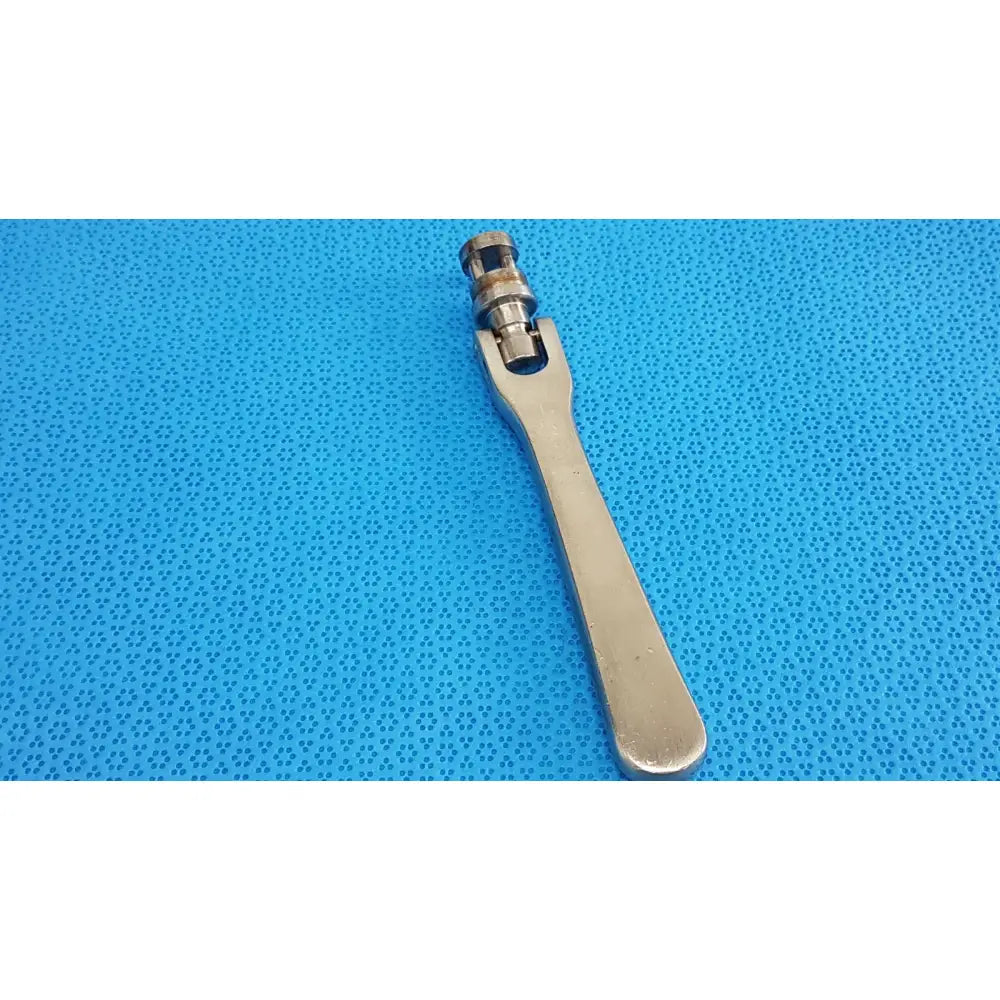Silver-colored metal octobase retractor handle with long handle and adjustable head for surgical retractor positioning