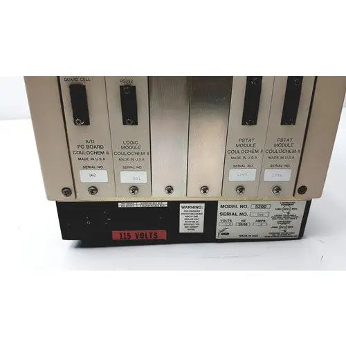 Industrial-grade metal control panel with labeled modules and red 115 volts warning on oem esa coulochem ii electrochemical detector