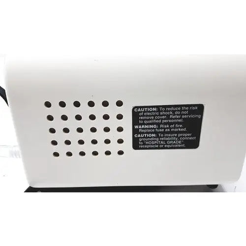 White plastic back side of ohio medical care-e-vac 3 portable suction device with black caution label and ventilation holes