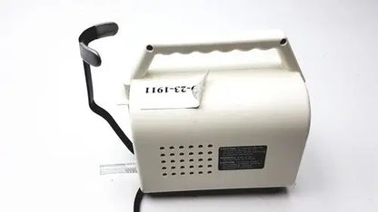 Cream-colored plastic electric hand mixer with black handle and power cord for ohio medical care-e-vac 3 portable suction device