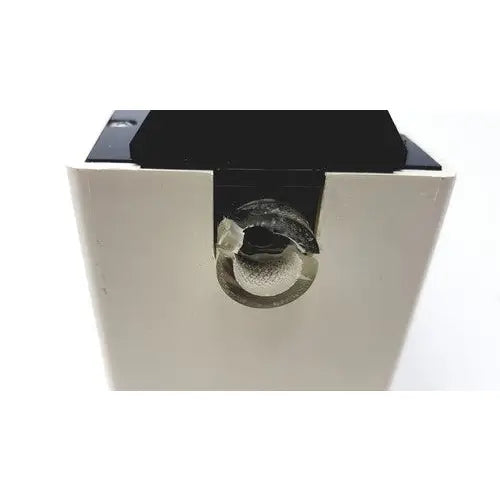 Black and white plastic ohio medical products intermittent suction unit with circular textured component in center