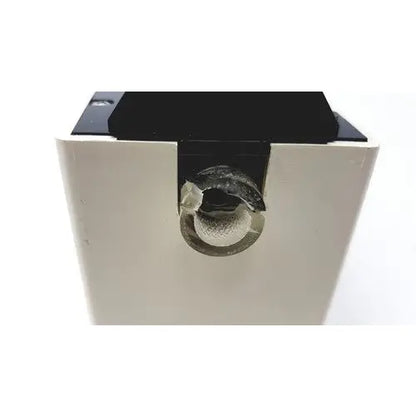 Black and white plastic ohio medical products intermittent suction unit with circular textured component in center