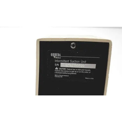 Beige ohio medical products intermittent suction unit labeled ormeda medical with black label and silver screw