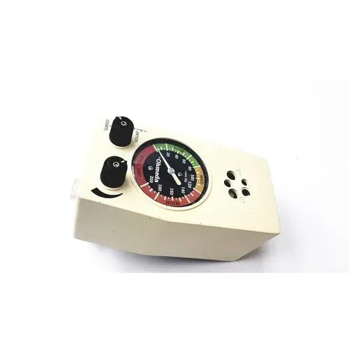 Cream-colored ohio medical products intermittent suction unit with circular gauge displaying red green and yellow zones
