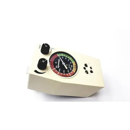 Cream-colored ohio medical products intermittent suction unit with circular gauge displaying red green and yellow zones