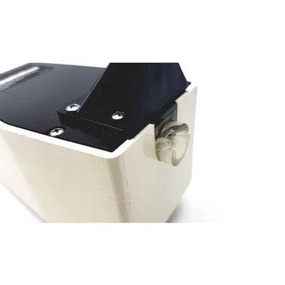 Black and beige plastic tape dispenser with metallic screw for ohio medical products intermittent suction unit top cover