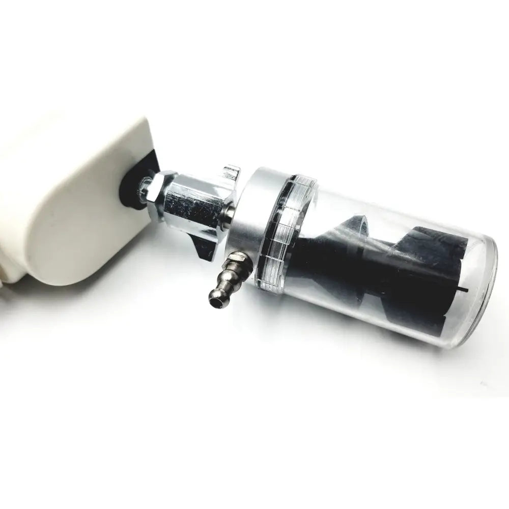 Clear cylindrical air filter with metallic silver top and black internals attached to white housing for ohio medical vacuum regulator model 1251
