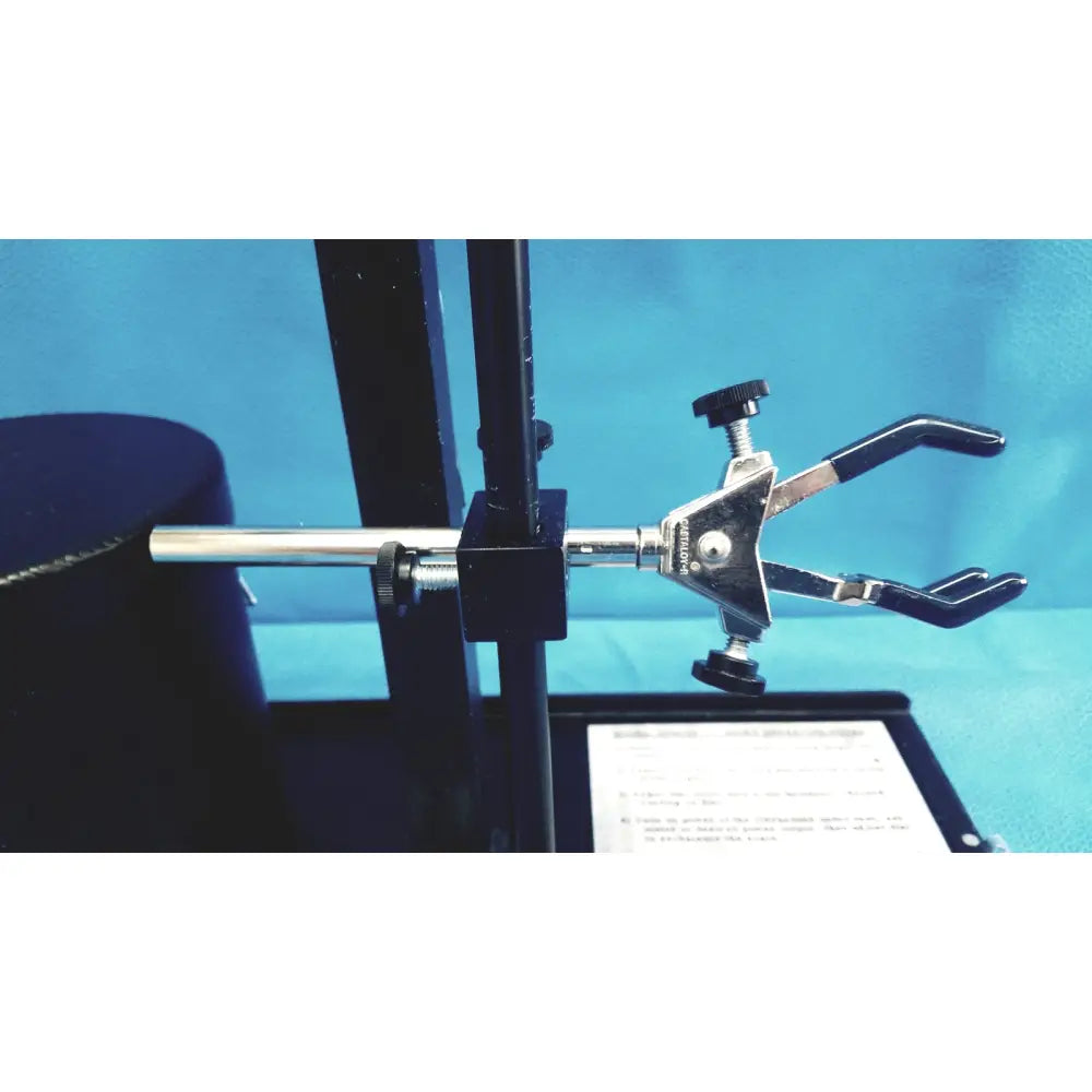 Black and silver laboratory clamp with adjustable jaws for holding glassware in ohmic instruments ultrasound power meter scale
