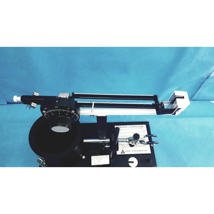 Black and white ohmic instruments upm-30 ultrasound power meter with circular dial metal components and adjustable arms