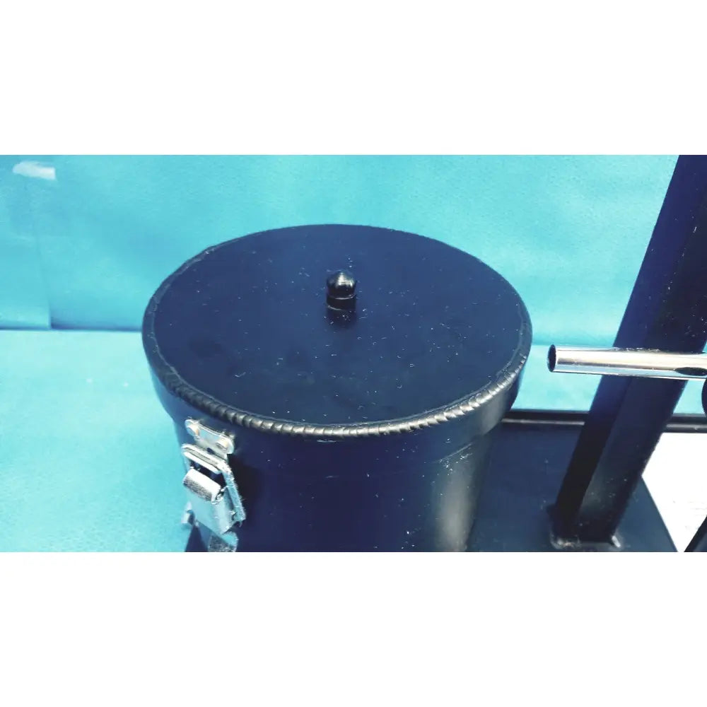 Black cylindrical ohmic instruments upm-30 ultrasound power meter scale with silver buckle and knob on top