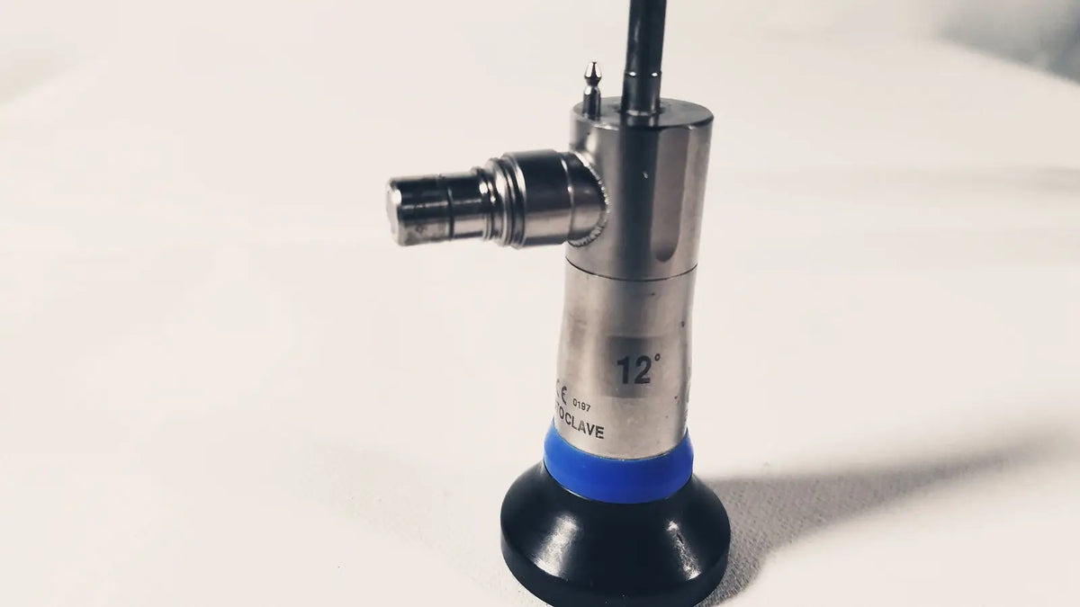 Silver metallic olympus a1931a autoclavable 4mm endoscope with blue rubber band and black base marked 12 degrees