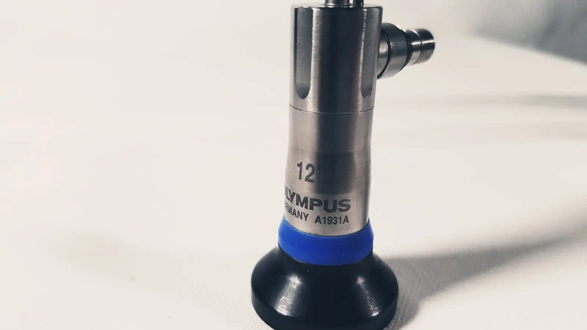 Silver and black olympus a1931a autoclavable 4mm 12 degree telescope with a blue band near the base