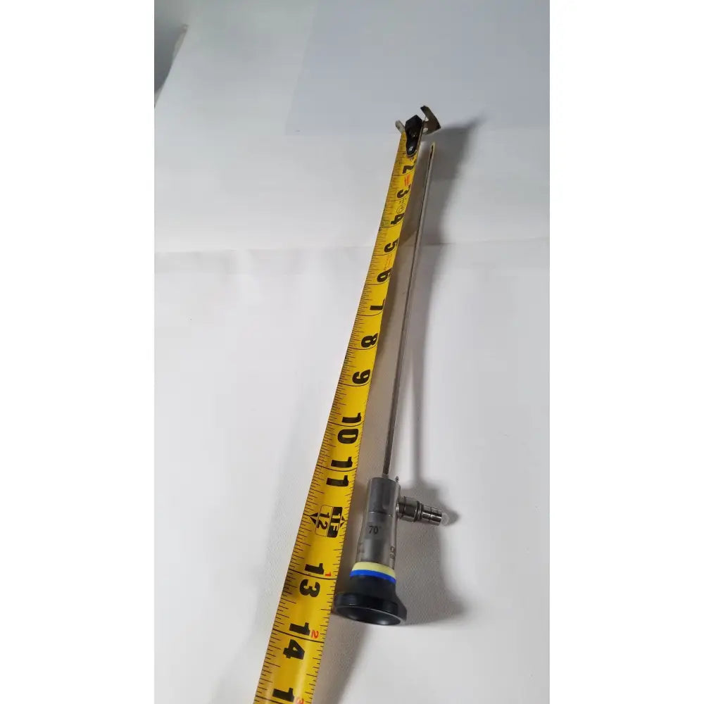 Olympus a1933a 4mm 70 degree metallic endoscope with black and silver body and yellow measurement tape