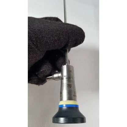 Silver surgical endoscope olympus a1933a 4mm with 70-degree angled tip black rubber grip and yellow-blue accent bands
