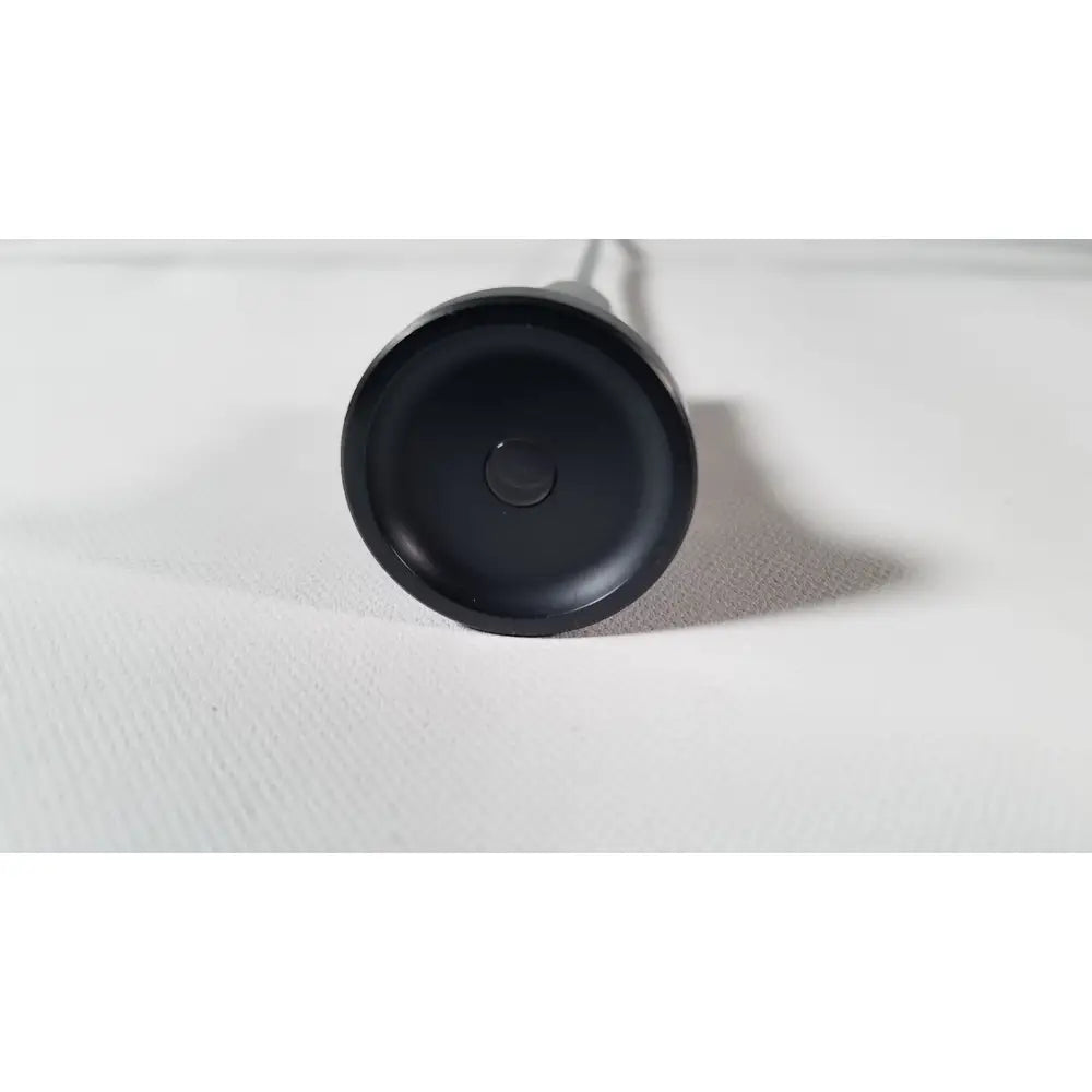 Black circular base of the back side of olympus a1933a 4mm 70 degree scope wireless charging pad