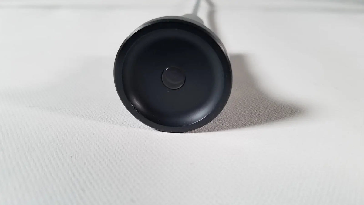 Black circular base of the back side of olympus a1933a 4mm 70 degree scope wireless charging pad