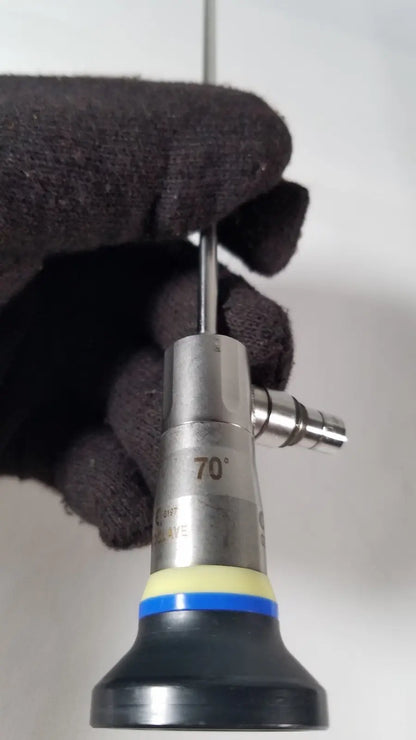 A metallic olympus a1933a 4mm surgical endoscope with 70 degree angled tip and black rubberized base with blue yellow accents