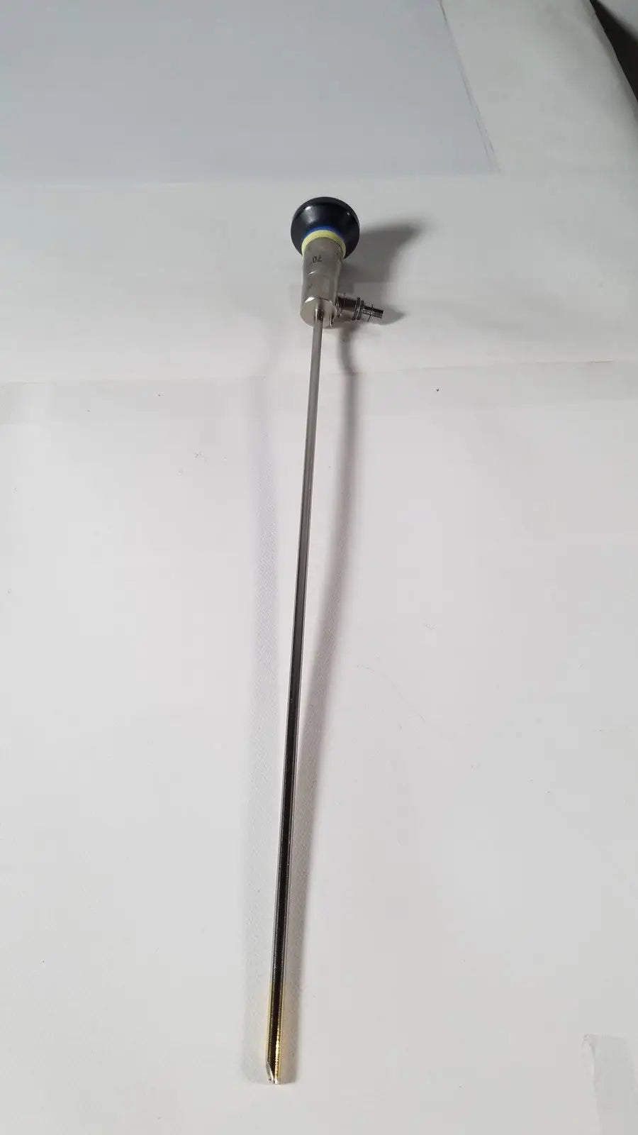 Silver surgical endoscope with black rounded tip and metallic joints olympus a1933a 4mm 70 degree scope