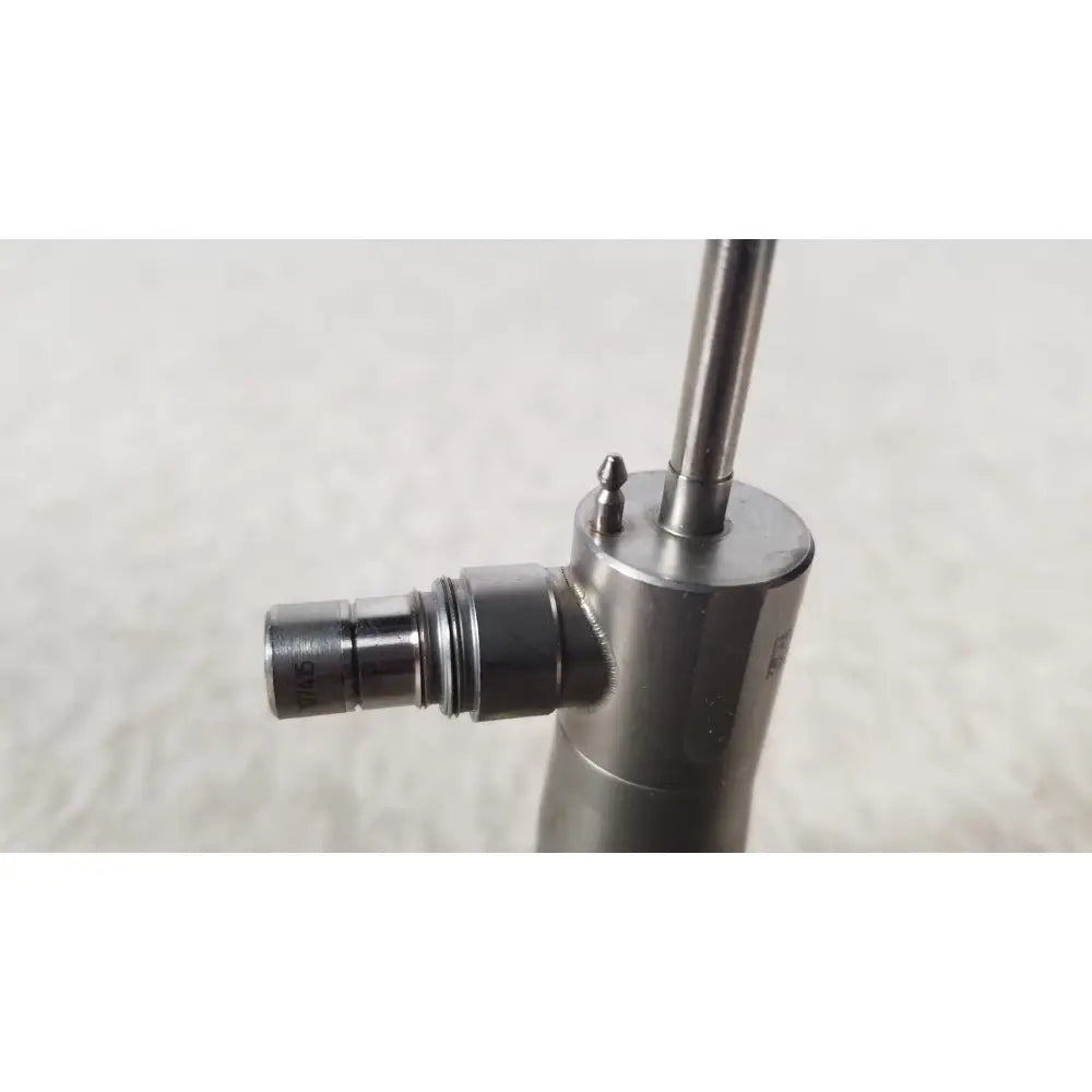 Silver metallic medical-grade syringe with cylindrical barrel and threaded plunger in olympus a1933a autoclavable scope