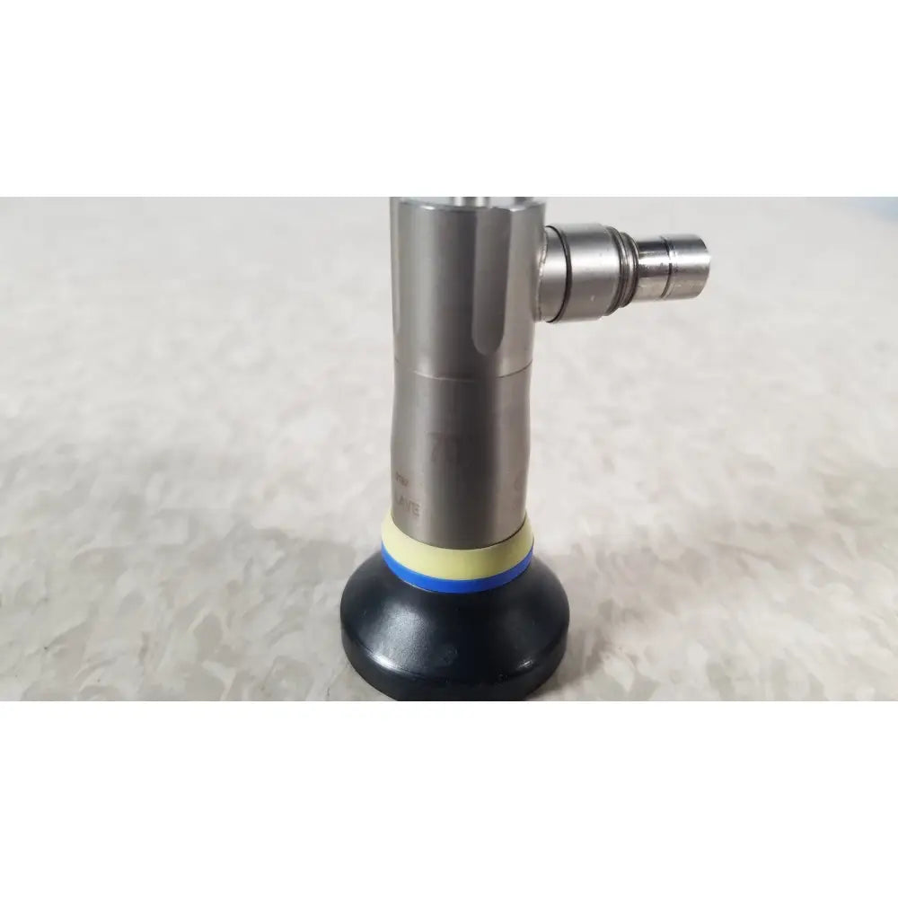 Silver metallic olympus a1933a autoclavable rigid endoscope with black rubber base and yellow blue sealing ring