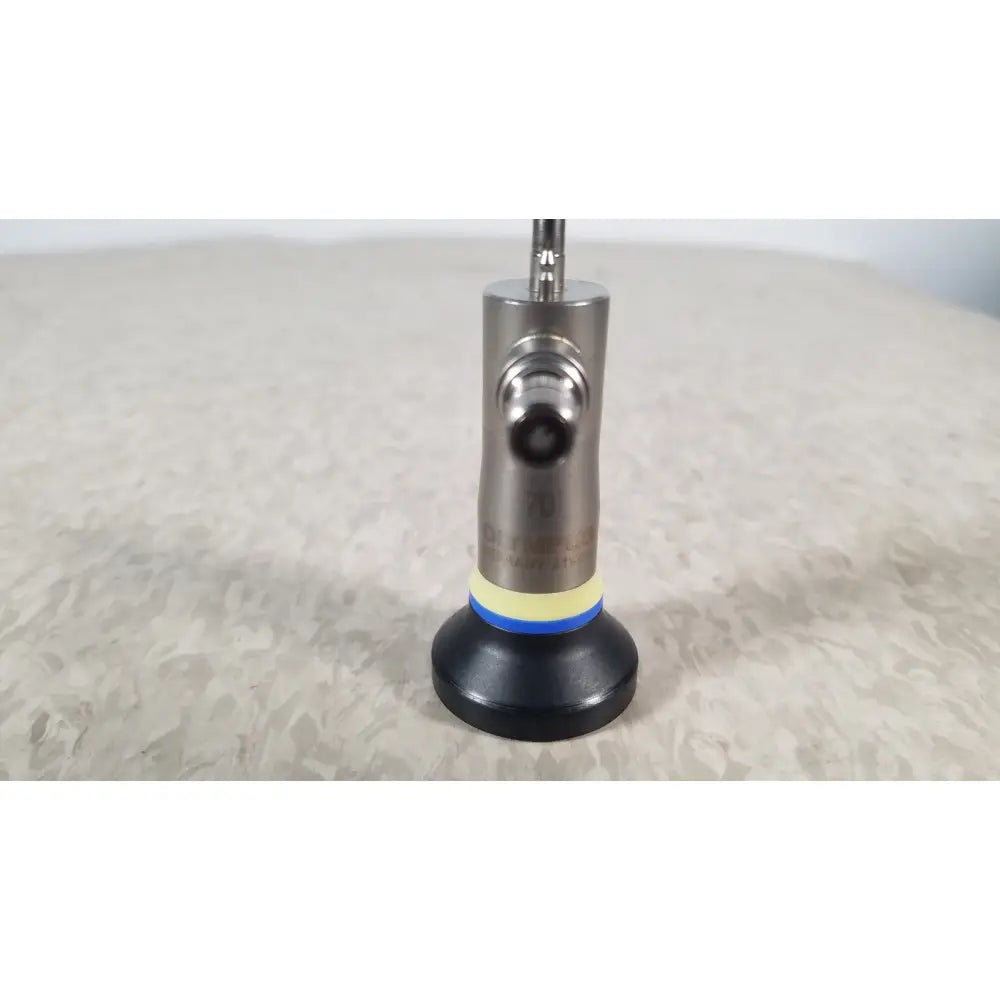 Silver metallic olympus a1933a autoclavable rigid scope with black base and yellow blue ring accent angled at 70 degrees