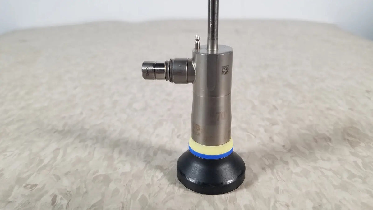 Olympus a1933a autoclavable rigid scope with metallic body and black rubber base ring accented by yellow and blue bands