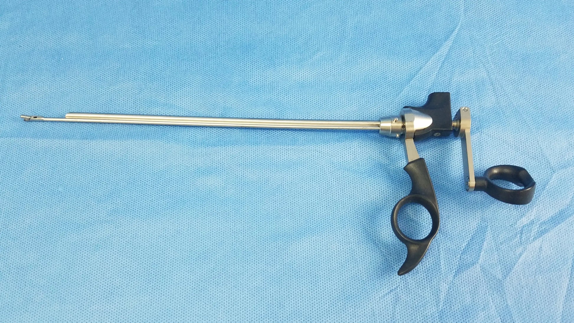 Black-handled Olympus A20713A optical biopsy spoon forceps with long metallic shaft and articulated joint for 30° telescope
