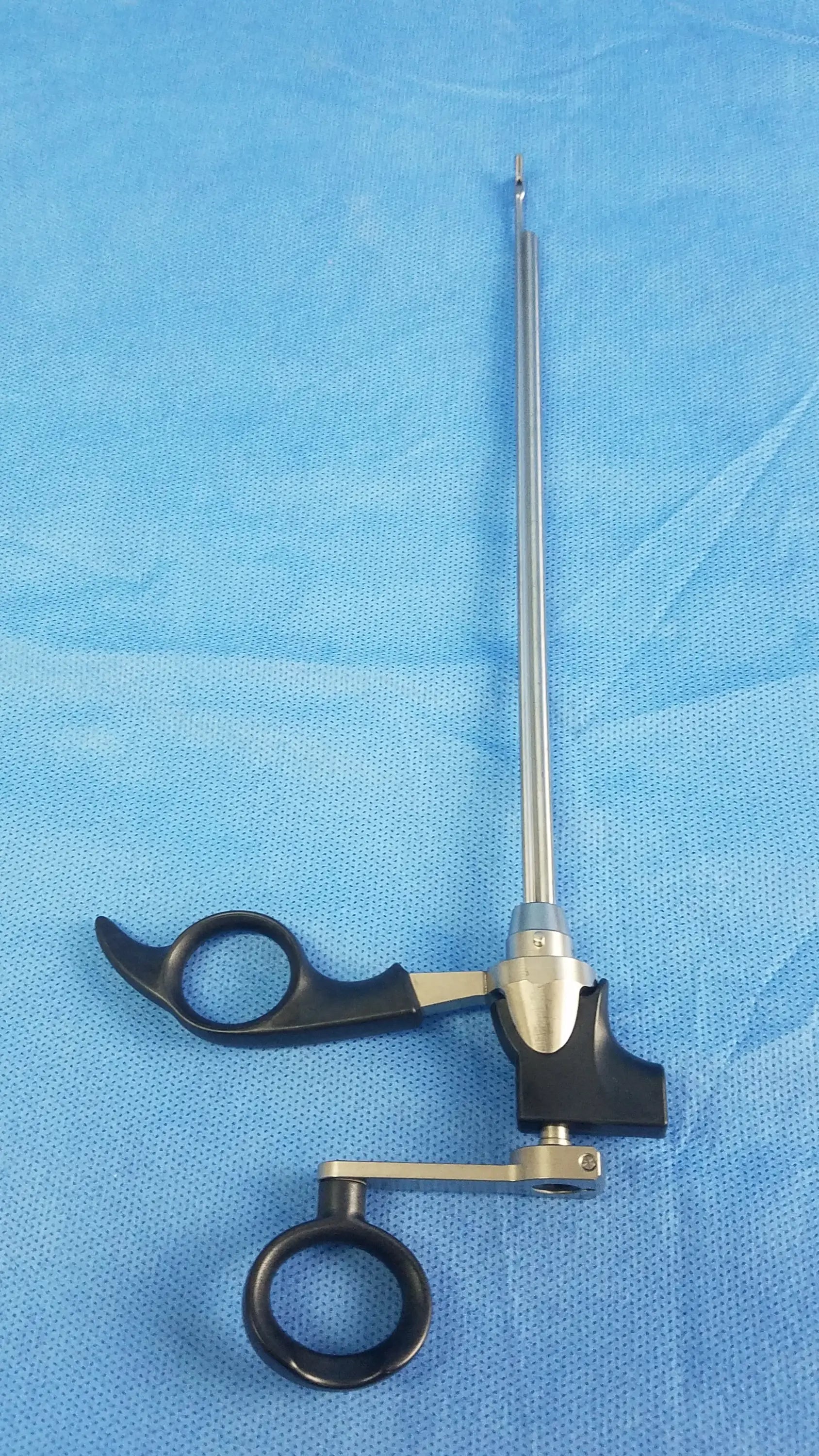 Black and silver Olympus A20713A optical biopsy spoon forceps with ergonomic handles and precision tip for 30° telescope use