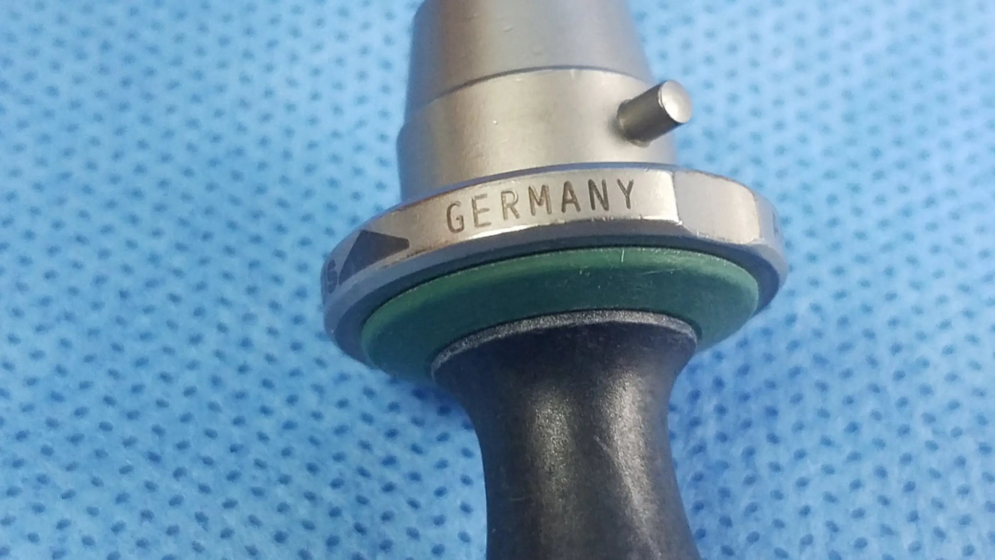 Silver metallic standard obturator instrument component with green seal and black handle compatible olympus germany mark