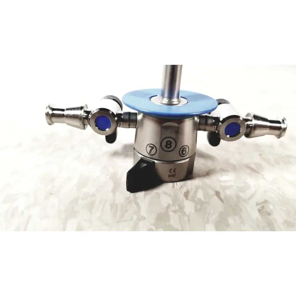 Stainless steel surgical instrument with blue circular caps and numbered markings olympus a20933a 21fr blue sheath obturator