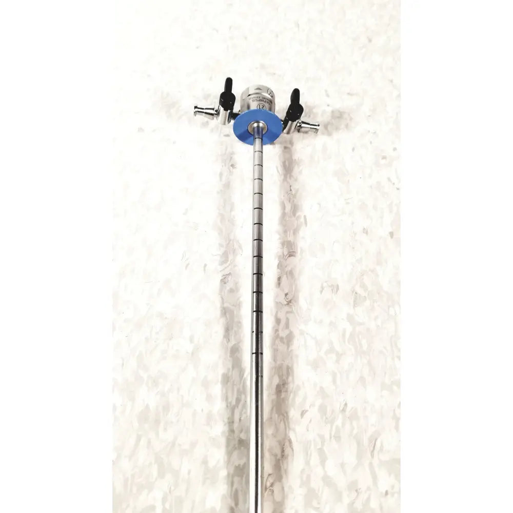 Silver surgical endoscope with blue circular component and black knobs from olympus a20933a 21fr blue sheath obturator