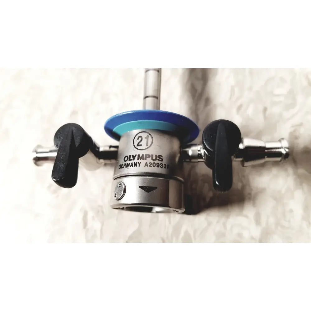Silver metallic olympus a20933a 21fr endoscope adapter with black handles and blue circular top marked 21fr model a20933a