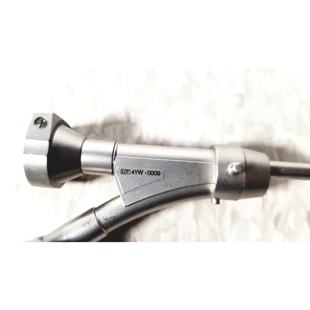 Silver metallic olympus a20975a endoscope bridge with black rubberized grip and engraved model number 4yw-0009 on body
